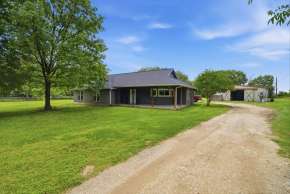 acreage homes for sale in Tomball TX with barn and land